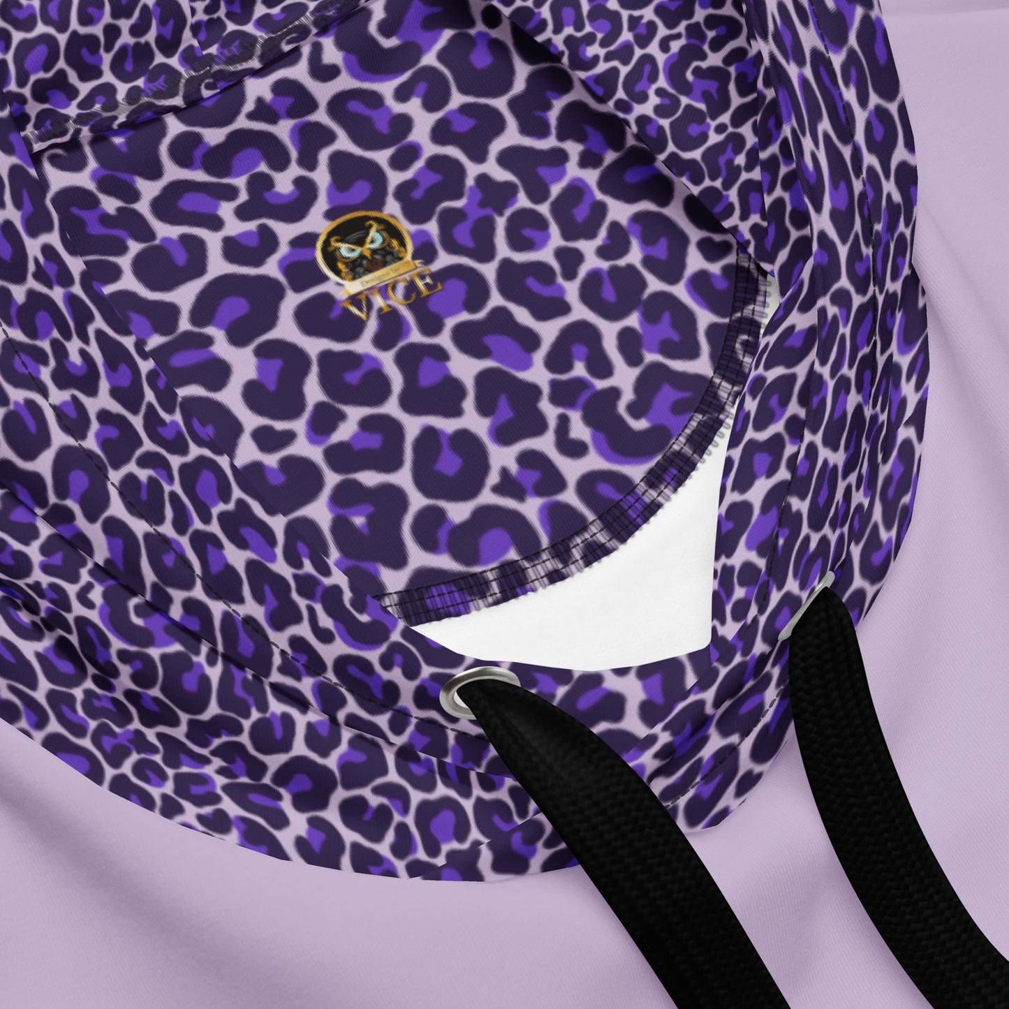 Closeup view of just the hood design of my purple leopard spot hoodie design for women. This shirt is intended for those who have (or have had) pancreatic cancer, pancreas disease, and for the who have gone through the Whipple Surgery. The closeup view also shows my logo, which is an owl that says "Designs by Vice".