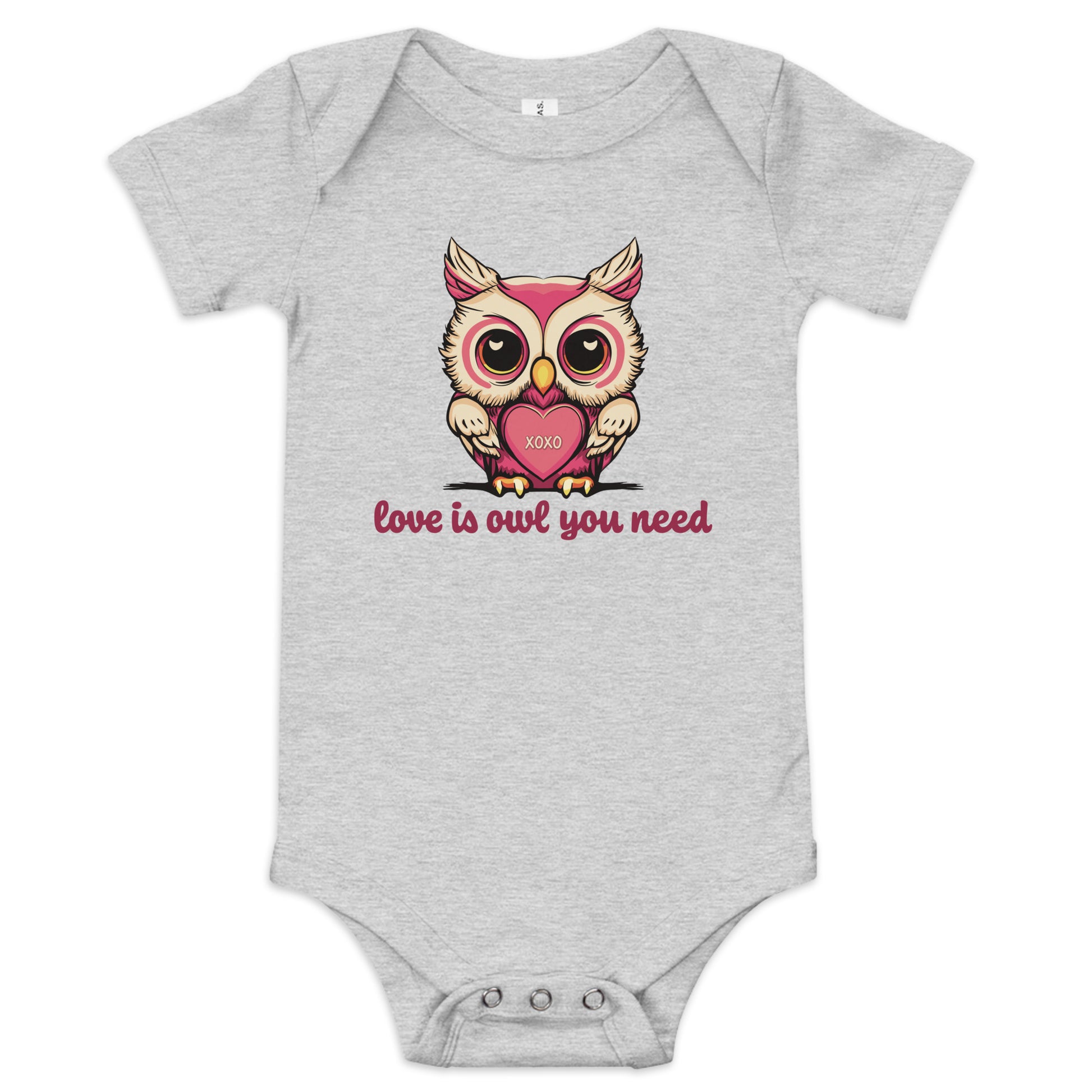 Pictured is a grey one piece bodysuit with short sleeves and 3 snaps for baby girls to wear for Valentine's Day. The cute graphic design       is a pink and beige colored owl holding a heart that says "xoxo". The words underneath the owl artwork say "love is owl you need". This       adorable infant clothing for girls comes in 4 colors, pink, grey, yellow, and white. Sizes available are 3-6 months, 6-12 months, and  12-18 months.