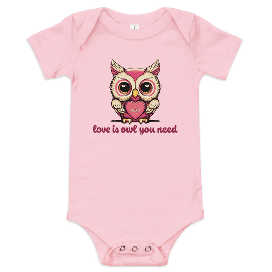 Pictured is a pink one piece bodysuit with short sleeves and 3 snaps for baby girls to wear for Valentine's Day. The cute graphic design       is a pink and beige colored owl holding a heart that says "xoxo". The words underneath the owl artwork say "love is owl you need". This       adorable infant clothing for girls comes in 4 colors, pink, grey, yellow, and white. Sizes available are 3-6 months, 6-12 months, and  12-18 months.