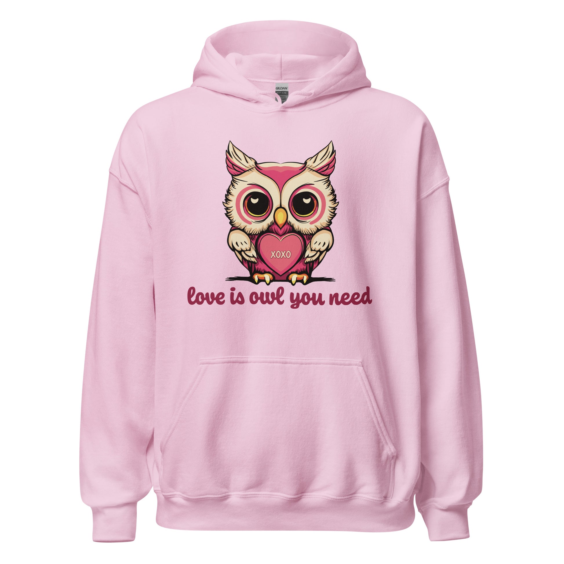 Pictured is a pink hooded sweatshirt for women to wear for Valentine's Day. The cute graphic design is a pink and beige colored owl holding a  heart that says "xoxo". The words underneath the owl artwork say "love is owl you need". This adorable ladies' hoodie comes in 4 colors,  sport grey, sand, light pink, and white. Sizes available are S, M, L, XL, 2XL, 3XL, 4XL, and 5XL.